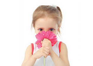 a girl holding a flower can breathe better after having Adenoidectomy surgery